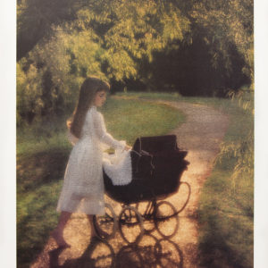 Little girl in a white dress standing the sunlight with her stroller and doll.